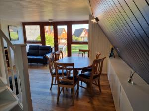 a dining room with a table and chairs at Chalet Brightstone Kingsdown Cliffs location with indoor pool, tennis court, mini-golf short walk to beach and 3 great local pubs in Kingsdown