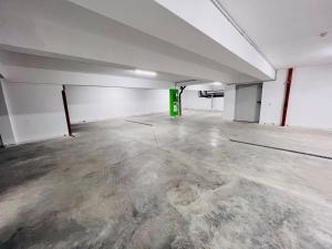 a large empty room with a concrete floor at RUBO Hotel in Shumen
