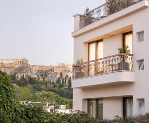 a building with a view of the mountains at Altar Suites in Athens