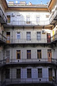 an old building with balconies on top of it at R69 Apartment in Budapest