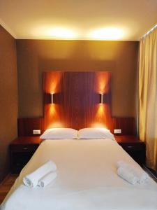Postel nebo postele na pokoji v ubytování Milky Way Hotel