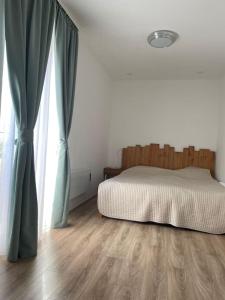 A bed or beds in a room at Buda Castle Toldy Apartment