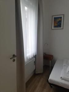 Posteľ alebo postele v izbe v ubytovaní Buda Castle Toldy Apartment
