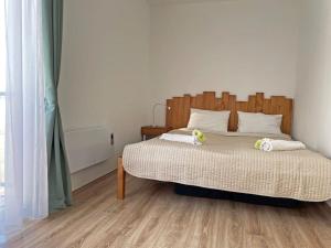 Posteľ alebo postele v izbe v ubytovaní Buda Castle Toldy Apartment