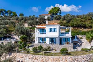 a villa with a view of the ocean at villa Avaton near Skopelos town in Skopelos Town