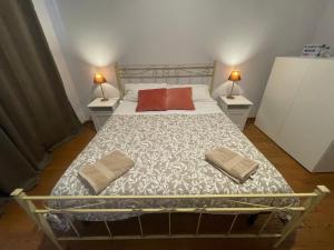 Postel nebo postele na pokoji v ubytování Paradise Rooms - Brignole Station