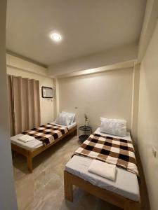Postel nebo postele na pokoji v ubytování Antelmi Travelers Inn