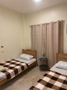 Postel nebo postele na pokoji v ubytování Antelmi Travelers Inn