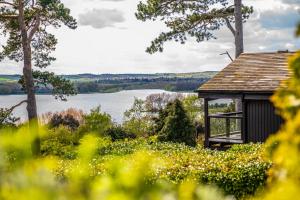 a gazebo with a view of a lake at Rutland Hall Hotel & Spa in Oakham