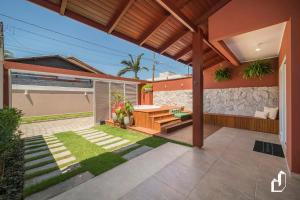 Κήπος έξω από το Casa com 02 dormitórios e jacuzzi aquecida