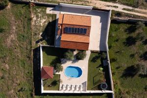 Bazén v ubytování Holiday house Dalma nebo v jeho okolí