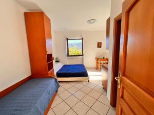Postel nebo postele na pokoji v ubytování B&b L' Arancio in fiore