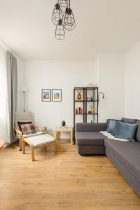 a living room with a couch and a table at The Grassmarket Apartment in Edinburgh