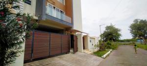 a child walking in front of a house at Private 4-BHK Villa with Swimming Pool, Wifi, BBQ in Chennai