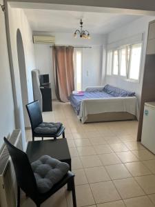 Postel nebo postele na pokoji v ubytování Christos + 16 fotografií