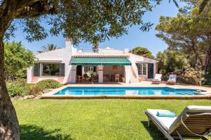 a villa with a swimming pool in a yard at Villa Hércules 115 Binidali in Cap d'en Font
