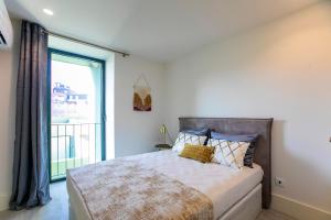 En eller flere senge i et værelse på Loulé Luxury Garden W/ AC