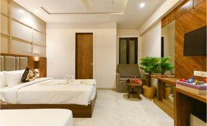 Postel nebo postele na pokoji v ubytování Hotel Avalon Palms Agra + 11 fotografií