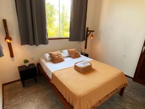 Postel nebo postele na pokoji v ubytování Mandala Hostel Jeri