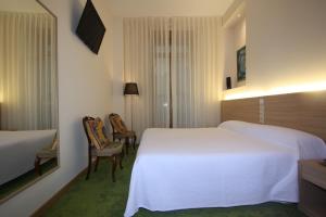 Posteľ alebo postele v izbe v ubytovaní Hotel Cal Piteu