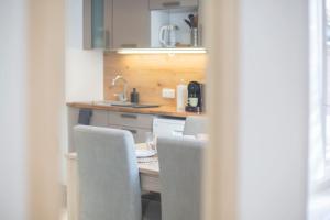 Kuchyňa alebo kuchynka v ubytovaní Bel appartement lumineux proche du centre-ville
