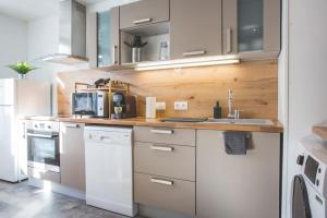 Kuchyňa alebo kuchynka v ubytovaní Bel appartement lumineux proche du centre-ville