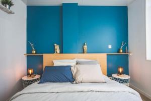 Posteľ alebo postele v izbe v ubytovaní Bel appartement lumineux proche du centre-ville