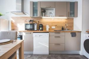 Kuchyňa alebo kuchynka v ubytovaní Bel appartement lumineux proche du centre-ville