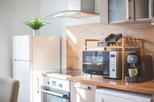 Kuchyňa alebo kuchynka v ubytovaní Bel appartement lumineux proche du centre-ville