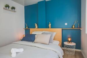 Posteľ alebo postele v izbe v ubytovaní Bel appartement lumineux proche du centre-ville