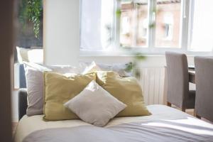 Posteľ alebo postele v izbe v ubytovaní Bel appartement lumineux proche du centre-ville