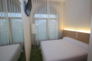 Posteľ alebo postele v izbe v ubytovaní Hotel Cal Piteu