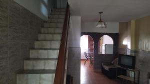 a staircase in a house with a living room at Casa de vacaciones Faro 1 in Mar del Plata