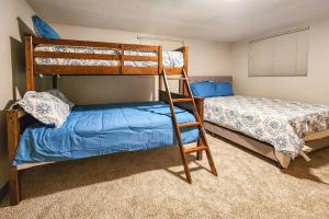 a bedroom with two bunk beds and a bed at Family-Friendly Yakima Escape with Yard and Pool! in Yakima