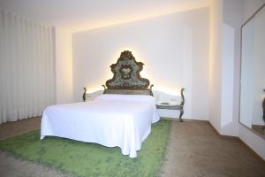 Posteľ alebo postele v izbe v ubytovaní Hotel Cal Piteu
