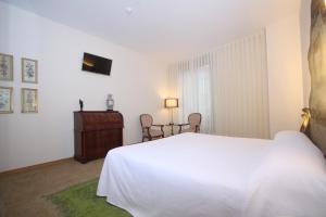 Posteľ alebo postele v izbe v ubytovaní Hotel Cal Piteu