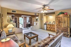 a living room with a couch and a table at Tucson Home - Hiking Trail Access On-Site! in Avra