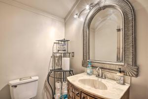 a bathroom with a sink and a mirror and a toilet at Greenville Apt w/ Patio: Work, Play & Unwind! in Greenville +27 photos