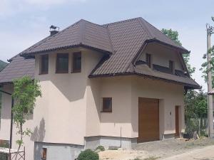 a house with a brown roof on top of it at Apartmani Jelenača in Sinanovići
