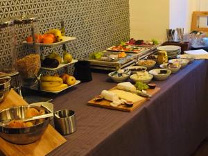 a table with many different types of food on it at CAESARO Hotel & Pizzeria - 20 Jahre Familienunternehmen in Hagen +7 photos