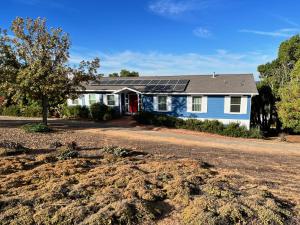 a house with solar panels on top of it at House on Organic Farm in Escondido