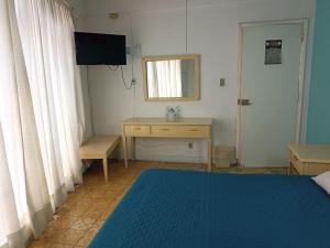 Voodi või voodid majutusasutuse Hotel San Carlos toas