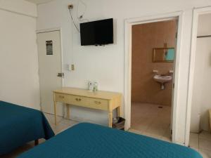 Voodi või voodid majutusasutuse Hotel San Carlos toas