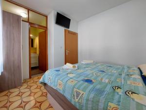 Postel nebo postele na pokoji v ubytování Apartments and Room Ivanka Petar