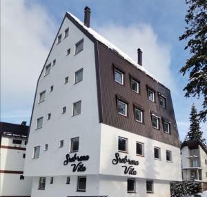 a building with the words sherbourne vale painted on it at Apartmani MONTES Jahorina in Jahorina