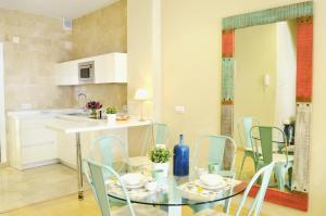 A kitchen or kitchenette at HomeySeville-Penthouse Cathedral Tomas de Ibarra St 6 pax, Parking Optional
