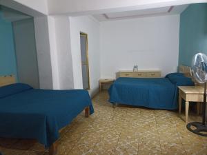 Voodi või voodid majutusasutuse Hotel Viena toas