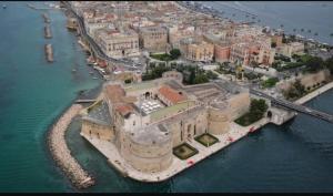 an aerial view of a large building in the water at La casa di Teresa in Taranto