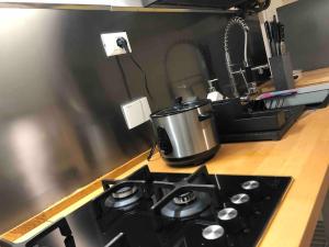 a kitchen stove with a pot on top of it at Double Accomodation In San Frediano in Florence