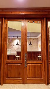 a pair of wooden doors in a room at Social House in Addis Ababa